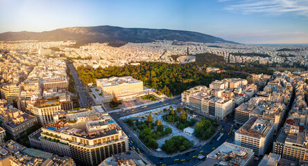 Wall Mural - Panoramic aerial view of the City Center of Athens, Greece, with Syntagma Square and Parliament building during golden sunset time