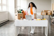 © Prostock-studio - Arabic Clothing Designer Lady Websurfing On Laptop At Fashionable Shop