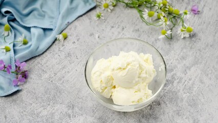 Wall Mural - Home made vanilla ice cream scoops in glas bowl on light background. Summer concept