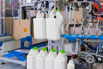 Poster - Filling bottles with water, Bottling factorys, plastic canisters,  Empty plastic jerrycans moving on conveyor belt of automatic pet blow molding machine at factory