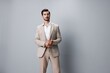 © SHOTPRIME STUDIO - beige man business happy portrait suit smiling handsome businessman copyspace studio