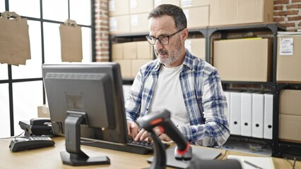 Canvas Print - Middle age man ecommerce business worker using computer at office