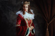 © Alliance - medieval queen in red dress with white collar and crown