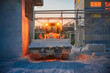© nordroden - Wheel loader with bright lights transports lime in bucket