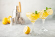© murziknata - Summer limoncello margarita cocktail with lemons and mint in a glass