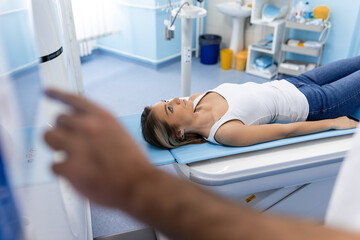 Medical equipment. Doctor and patient in the room of computed tomography at hospital.Doctor examining patient with CT scanner. Computerised tomography.