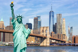 Fototapeta Miasta - New York City skyline of Manhattan with Statue of Liberty, Brooklyn Bridge and World Trade Center photomontage in the United States