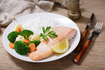 Wall Mural - plate of  salmon fillet, rice and vegetables