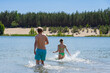 © Dmitri - People bathe in the forest lake on a summer day, Valdeku Karjäär.