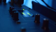 Recording Studios Audio Console And Knob. Sound Director Records Announcer With Led Monitor Sync Song Recorder Desk In Black Dark Blue Scenary HD