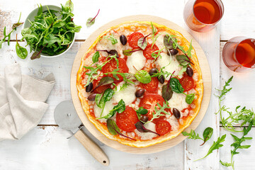 Wall Mural - Pizza. Margherita pizza with mozzarella, tomato, olives and fresh greens. Top view