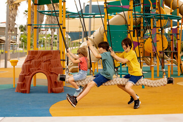 Sticker - Happy children, boys, playing on playground in Tel Aviv, israel on hot summer day