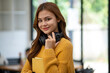 © Wuttichaik - Young Beautiful smiling happy student woman wearing headphone holding a book, Portrait of student girl carry book balancing books on head and hand