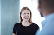 © KOTO - Smiling businesswoman talking to businessman