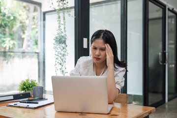 Sticker - Asian women are stressed while working on laptop, Tired asian businesswoman with headache at office, feeling sick at work