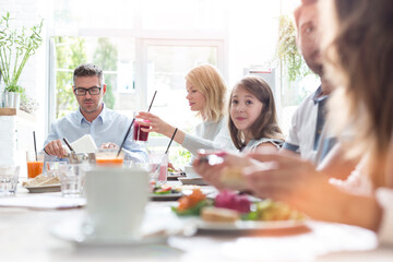 Wall Mural - Family eating at cafe table