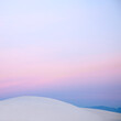 Pink sunset sky over white sdune, White Sands, New Mexico, United States