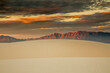 Dramatic sunset sky over sdunes mountains, White Sands, New Mexico, United States
