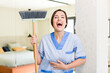young pretty woman laughing out loud at some hilarious joke. housekeeper concept