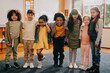 © Jacob Lund - Group of diverse primary school children standing together and looking at the camera