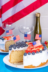 Wall Mural -  4th of July cake with flag and berries. Homemade Patriotic American flag striped vanilla cream sponge cake, Holiday Party summer dessert 
