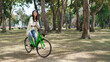 © snowing12 - Women riding bicycle with having fun to exercise activity with healthy lifestyle in the park