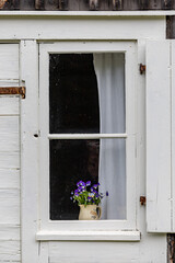 Wall Mural - Skelleftea, Sweden A cute windowsill and flowers  in the historic and culture neighborhood Bonnstan.