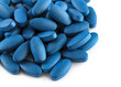 Blue spirulina isolated on white background. Blue oval shaped pills close up. Organic spirulina super food concept healthy. Food supplements with iodine to improve the functioning of the immune system