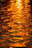 Fototapeta Morze - Water ripples reflected in the water at night. AI generative