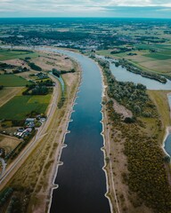 Poster - Aerial view of river surrounded by dense trees