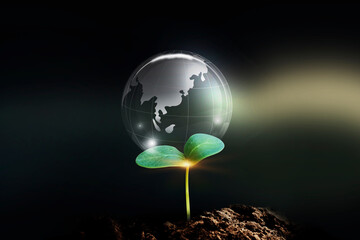 Environment, eco and energy saving concept. Energy resources crystal earth on sunny background.