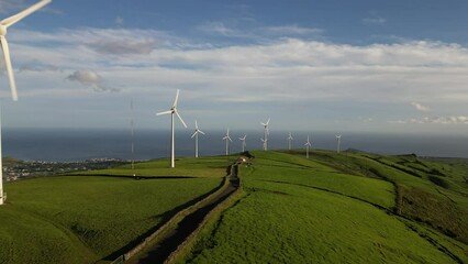 Canvas Print - Drone shot of beautiful Windfarm with blue cloudy sky