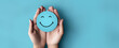 © Generative ART - Promoting Positive Mental Health: Hand Holding Blue Paper Cut Happy Smile Face for World Mental Health Day