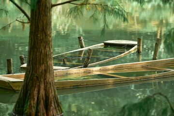 Closeup of a weathered sunk boats  on the still water of a beautiful lake