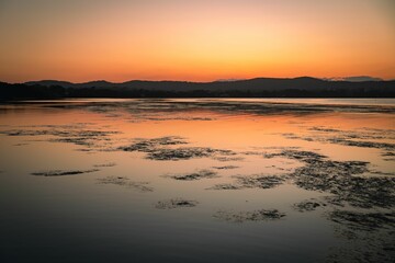 Sticker - Beautiful view of the lake and hills at sunset.