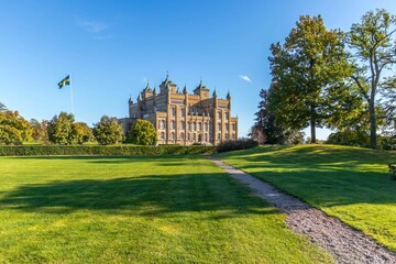 Wall Mural - Beautiful view of the Stora Sundby Castle with a garden on a sunny day