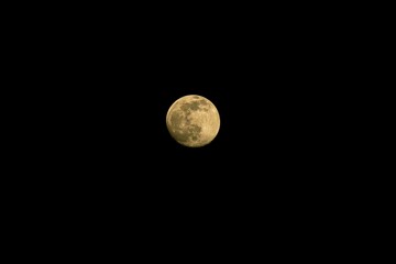 bright full moon in night dark sky