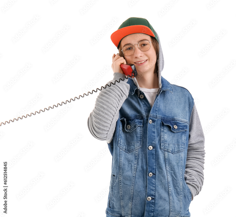 Cool teenage boy talking by telephone on white background