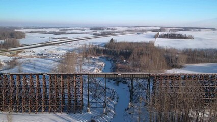 Poster - Aerial footage of the Rochfort Trestle Bridge in Alberta, Canada in winter