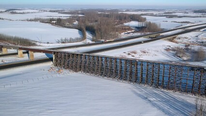 Canvas Print - Aerial footage of the Rochfort Trestle Bridge in Alberta, Canada in winter