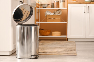 Poster - Opened metallic trash bin on floor in modern kitchen