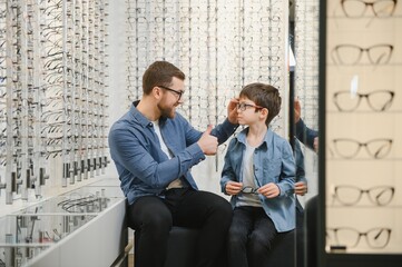 Poster - Father with cute son. Family buy glasses