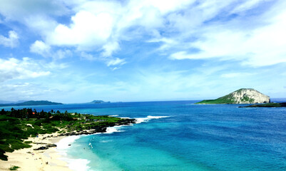 Wall Mural - Mesmerizing view of an island under a blue sky at daytime