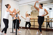 © JackF - Choreographer conducting classes in a ballet studio shows a female group the correct performance of a choreographic exercise