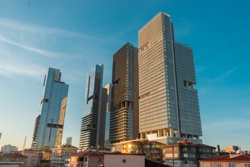 Wall Mural - Low angle shot of modern mirroring buildings in the urban area of Istanbul, Turkey