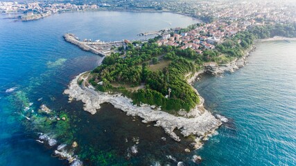 Poster - Aerial view of the coastline of an island with green vegetation