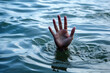 hand in sea asking help. person drowning and sinking. generative ai