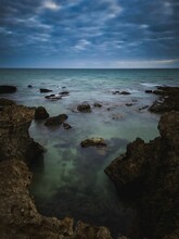 Vertical Shot Of The Rocky Coast Of Albufeira, Sao Rafael, Portugal