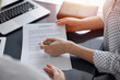 © rogerphoto - Business people sitting and discussing contract in office, closeup. Partners or lawyers working together at meeting. Teamwork and partnership.