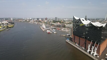 Canvas Print - Aerial view of cityscape Hamburg surrounded by buildings and water